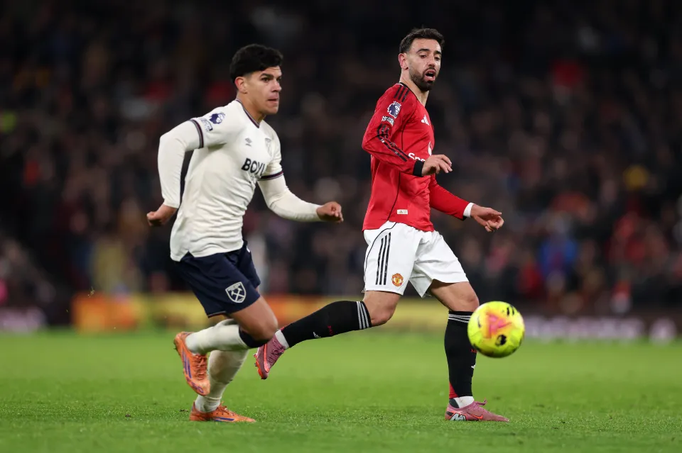 West Ham United's Mateus Fernandes and Manchester United's Bruno Fernandes contest the ball during a Premier League match