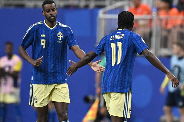Anthony Elanga of Sweden celebrates with Alexander Isak after scoring the first goal for his team