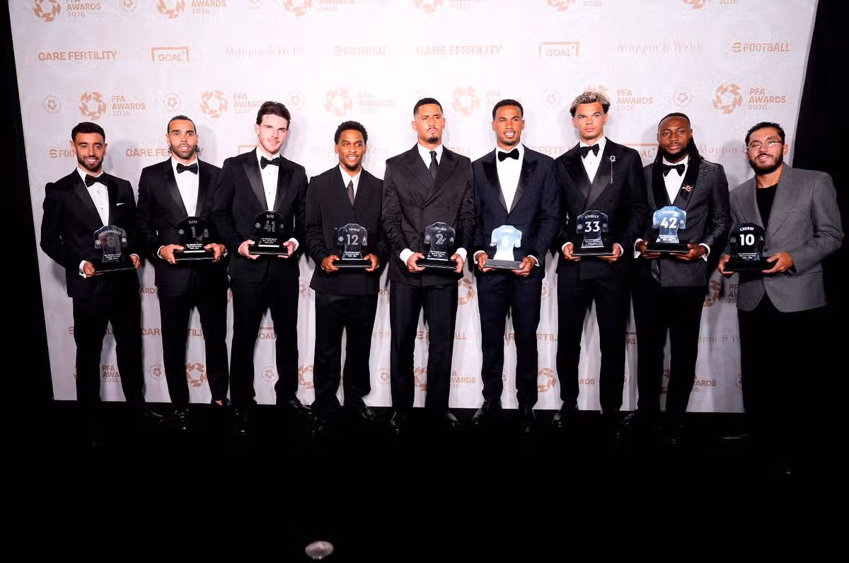 Bruno Fernandes, David Raya, Declan Rice, Jurrien Timber, William Saliba, Gabriel, Nico O'Reilly, Antoine Semenyo and Rayan Cherki with their PFA Premier League team of the year awards during the PFA Awards 2026