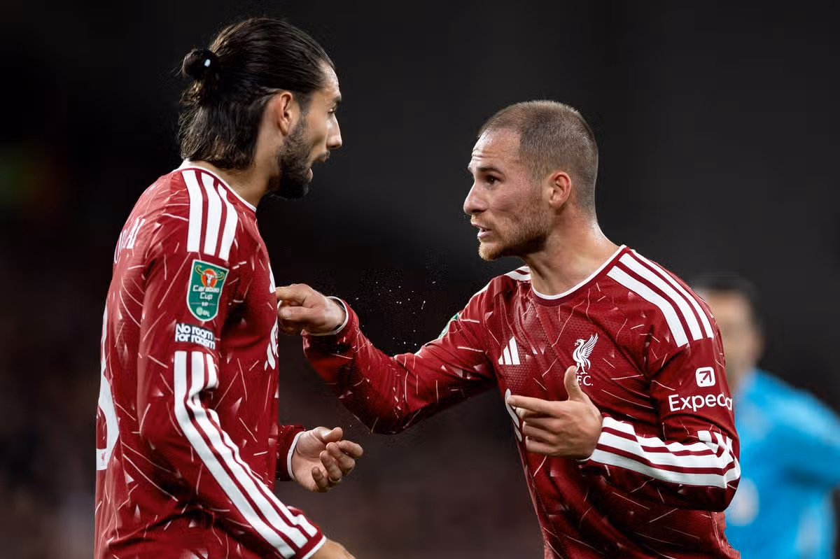 Alexis Mac Allister of Liverpool speaks to Dominik Szoboszlai of Liverpool during the Carabao Cup Third Round match between Liverpool and Tottenham Hotspur at Anfield on September 15, 2026 in Liverpool, England.