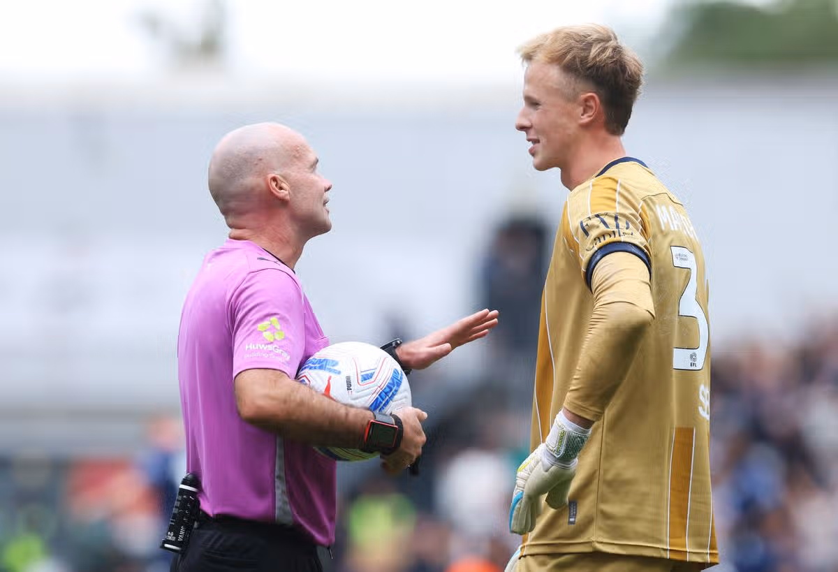 LONDON, ENGLAND - SEPTEMBER 19: Referee Paul Tierney reacts with Filip Marschall of Millwall during the Sky Bet Championship 2026/27 match between Millwall and West Ham United at The Den on September 19, 2026 in London, England. (Photo by Richard Pelham/Getty Images)